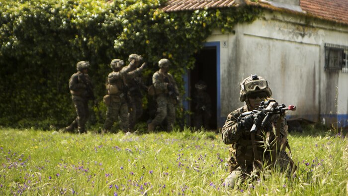 U.S. Marine Corps Lance Cpl. Christopher Geraci, an automatic rifleman with Special-Purpose Marine Air-Ground Task Force Crisis Response-Africa, posts security during an assault training exercise near Lisbon, Portugal, April 10, 2015. Marines stationed out of Moron Air Base, Spain, traveled to Portugal to utilize a variety of different ranges and training exercises alongside with the Portuguese Marines. After a week of training together, Marines and Fuzileiros were more familiar with each other's tactics and operating procedures. (U.S. Marine Corps photograph by Lance Cpl. Christopher Mendoza/Released)