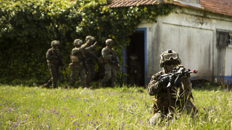 U.S. Marine Corps Lance Cpl. Christopher Geraci, an automatic rifleman with Special-Purpose Marine Air-Ground Task Force Crisis Response-Africa, posts security during an assault training exercise near Lisbon, Portugal, April 10, 2015. Marines stationed out of Moron Air Base, Spain, traveled to Portugal to utilize a variety of different ranges and training exercises alongside with the Portuguese Marines. After a week of training together, Marines and Fuzileiros were more familiar with each other's tactics and operating procedures. (U.S. Marine Corps photograph by Lance Cpl. Christopher Mendoza/Released)