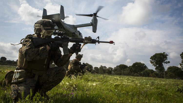 U.S. Marines with Special-Purpose Marine Air-Ground Task Force Crisis Response-Africa post security during an assault training exercise near Lisbon, Portugal, April 10, 2015. Marines stationed out of Moron Air Base, Spain, traveled to Portugal to utilize a variety of different ranges and training exercises alongside with the Portuguese Marines. After a week of training together, Marines and Fuzileiros were more familiar with each other's tactics and operating procedures. (U.S. Marine Corps photograph by Lance Cpl. Christopher Mendoza/Released)