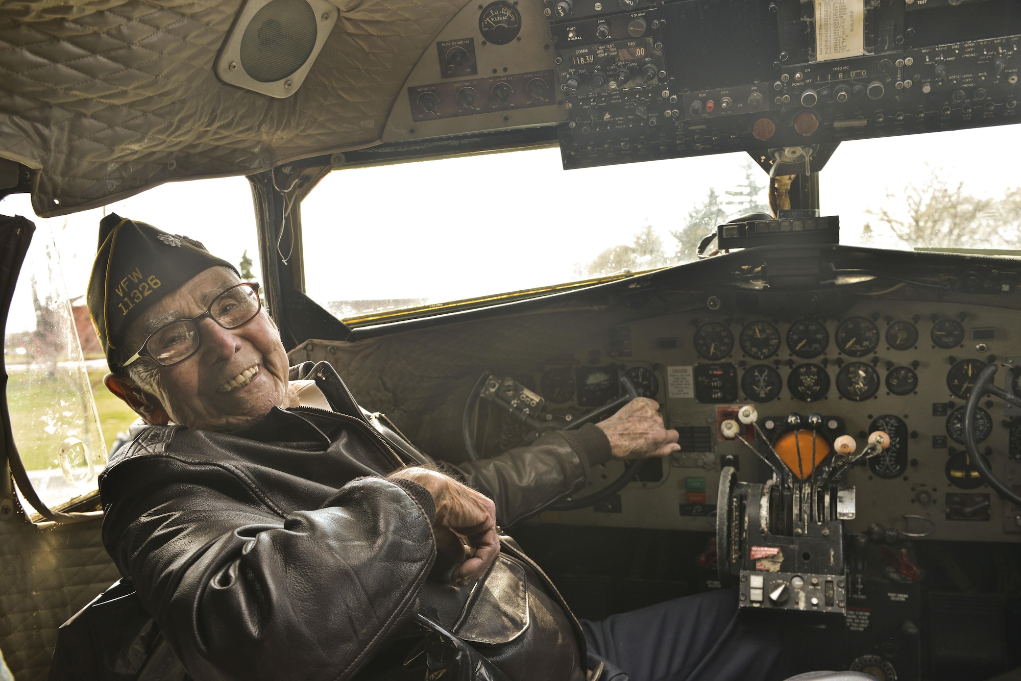 Retired Lt. Col. Alston Daniels beams as he sits in the cockpit of a Douglas C-47D Skytrain for the first time since 1962 April 7, 2015, at Fairchild Air Force Base, Wash. Daniels flew the C-47 during World War II and had the chance to visit the aircraft while it is on static display. (U.S. Air Force photo/Staff Sgt. Alex Montes)