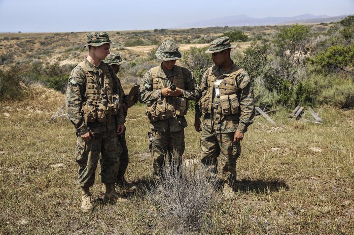 Recruits of Golf Company, 2nd Recruit Training Battalion, work together to find their next geographical point during the land navigation course at Edson Range, Marine Corps Base Camp Pendleton, Calif., March 31. Each navigation point is marked with a numbered ammunition can, and each pair of recruits was given a different route to follow. Recruits are given five points to find along the course, and while they had already plotted where each point was, they had to use what they learned to identify the correct direction. They were encouraged to use different terrain features and navigation tools to find the checkpoint. The pairs of recruits have separate responsibilities, one was responsible for a consistent pace count while the other maintained direction with the compass. Today, all male recruits recruited from recruiting stations west of the Mississippi are trained at MCRD San Diego. Today, all male recruits recruited from recruiting stations west of the Mississippi are trained at MCRD San Diego. The depot is responsible for training more than 16,000 recruits annually. Golf Company is scheduled to graduate May 8. 