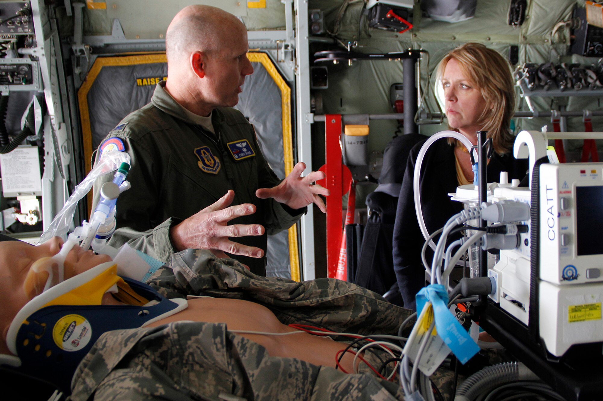 Col. Christopher Ryan, 302nd Aeromedical Staging Squadron commander and traditional reservist, briefs the Secretary of the Air Force Deborah Lee James on the capabilities and requirements of Critical Care Air Transport Teams April 15, 2015. Ryan, a hospital physician in his civilian career, also talked with the Secretary about how he balances the requirements of his civilian and military careers. (U.S. Air Force photo/Staff Sgt. Nathan Federico)