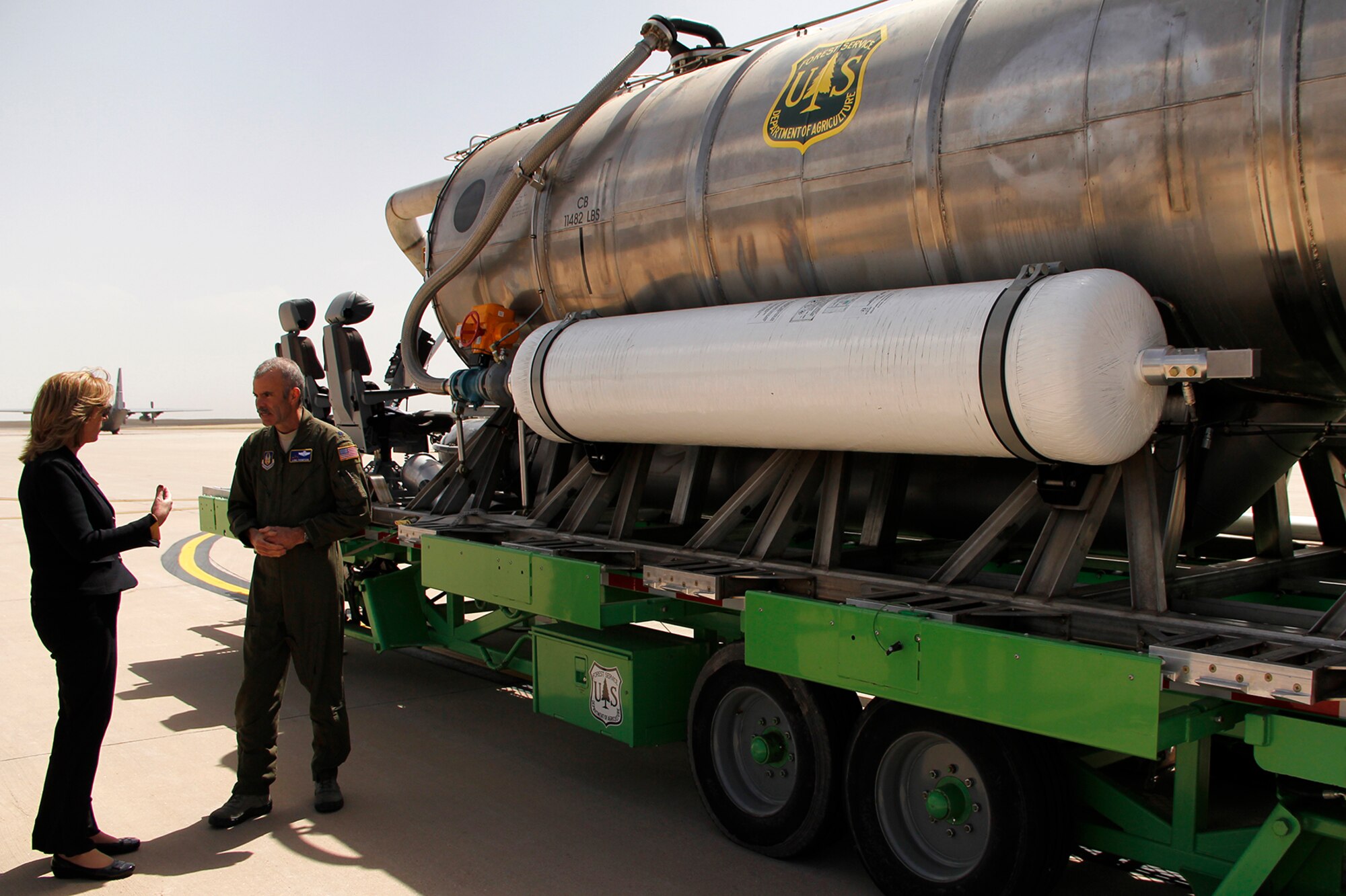 Lt. Col. Luke Thompson, 302nd Airlift Wing chief of aerial firefighting, shows Secretary of the Air Force Deborah Lee James a U.S. Forest Service Modular Airborne Fire Fighting II system, April 15, 2015. The system is used by the 302nd Airlift Wing during MAFFS missions, and the 302nd AW is the only Reserve wing, along with three Air National Guard wings, that fly the DoD MAFFS mission. (U.S. Air Force photo/Staff Sgt. Nathan Federico) 