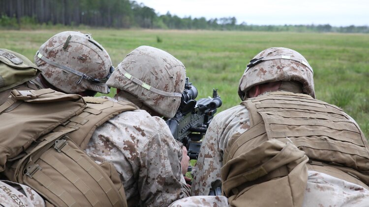 Lance Cpl. Preston Deweese, a light armored vehicle crewman with 2nd Light Armored Reconnaissance Battalion, takes aim with a M240 Bravo medium machine gun during a live-fire platoon attack exercise on Marine Corps Base Camp Lejeune, North Carolina, April 15, 2015. The exercise incorporated squad maneuver and assault from a concealed position with the supporting fire of two M240 medium machine guns.