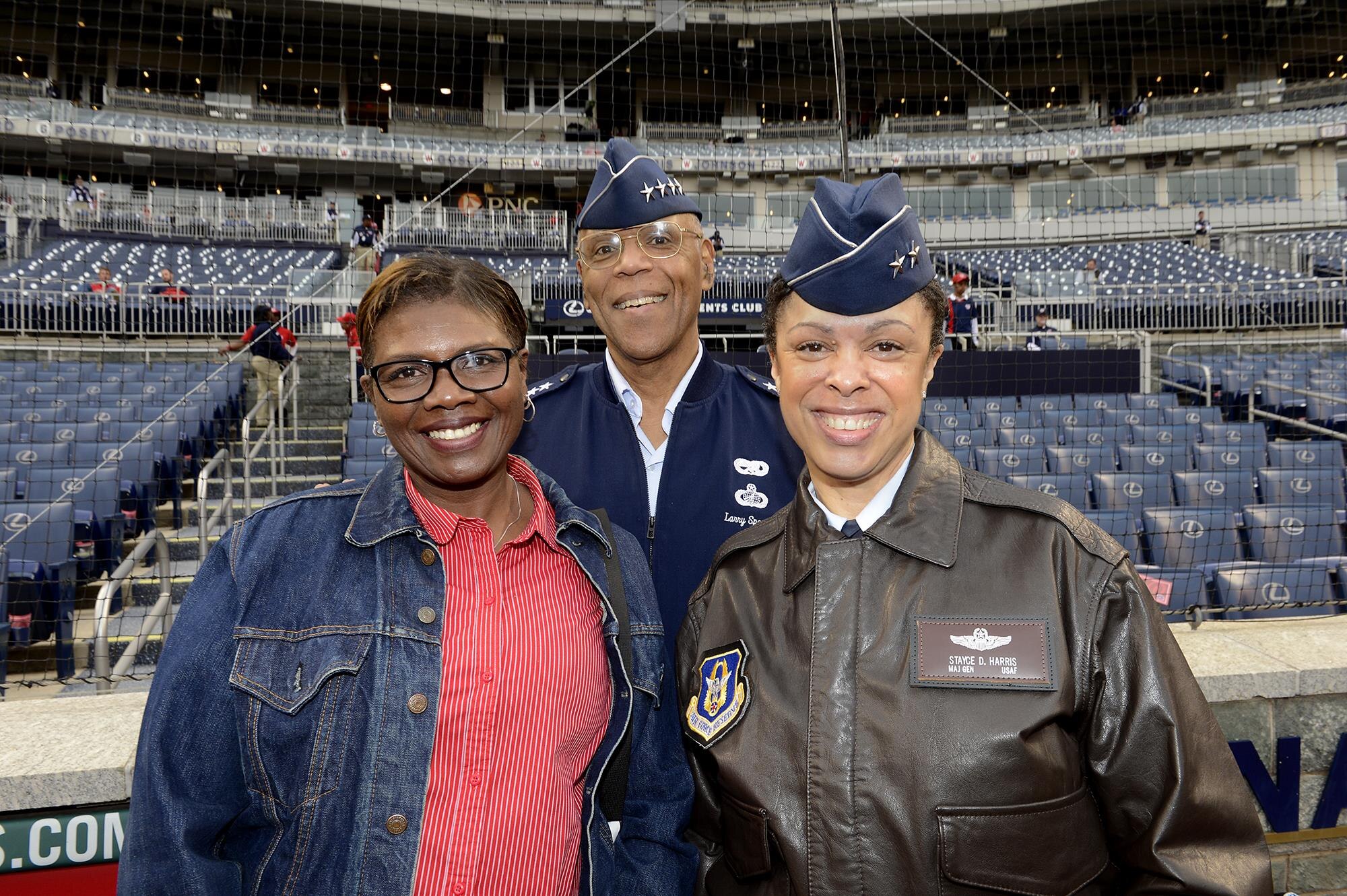 Air Force Vice Chief of Staff Gen. Larry O. Spencer, his wife, Ora, and Maj. Gen. Stayce D. Harris, the commander of the 22nd Air Force, Air Force Reserve Command pose for a picture before the Washington Nationals vs. Philadelphia Phillies game in Washington, April 17, 2015.  Harris was there to present the game ball to the pitcher at the start of the game, as the highest-ranking black female officer in the Air Force in honor of black heritage day at Nationals Park Stadium.  She also represented the Air Force Reserve for its 67th birthday.  (U.S. Air Force photo/Scott M. Ash)