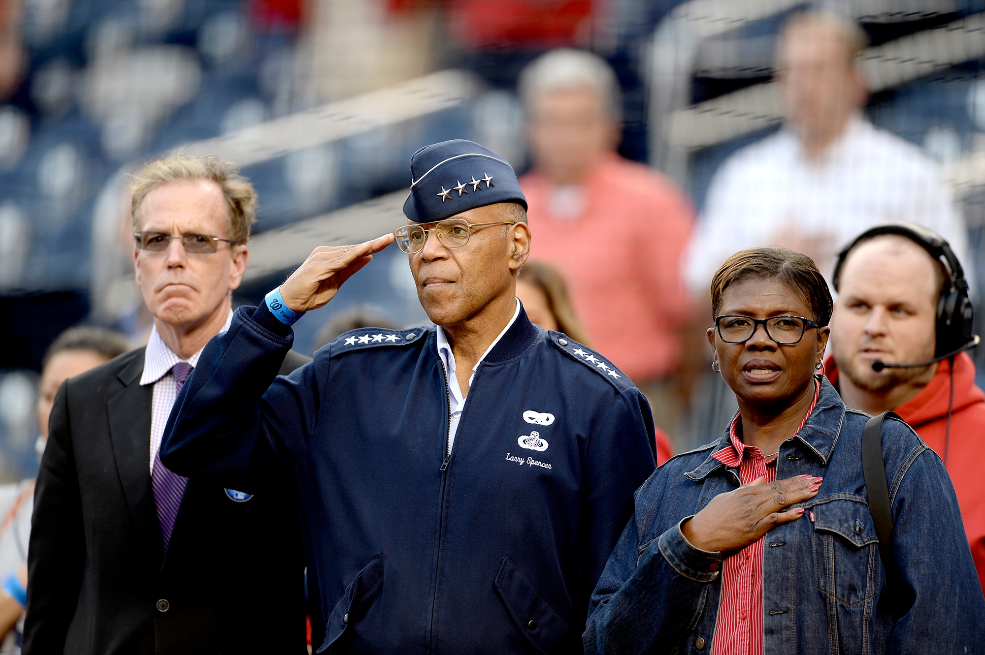 Air Force Vice Chief of Staff Gen. Larry O. Spencer, his wife, Ora, and Nationals Vice President Gregory McCarthy, stand for the National Anthem before the Washington Nationals vs. Philadelphia Phillies game in Washington, April 17, 2015.  Maj. Gen. Stayce D. Harris, the commander of the 22nd Air Force, Air Force Reserve Command, presented the game ball to the pitcher at the start of the game, as the highest-ranking black female officer in the Air Force in honor of black heritage day at Nationals Park Stadium.  She also represented the Air Force Reserve for its 67th birthday.  (U.S. Air Force photo/Scott M. Ash)