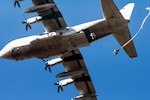 JOINT BASE ELMENDOR-RICHARDSON, Alaska (Apr. 13, 2015) - An Army paratrooper jumps from a U.S. Marine Corps C-130 Hercules aircraft over Malemute drop zone. The paratrooper is assigned to the 25th Infantry Division's 4th Infantry Brigade Combat Team. The paratroopers jumped in observance of Women's History Month to build camaraderie and leadership among service women. 