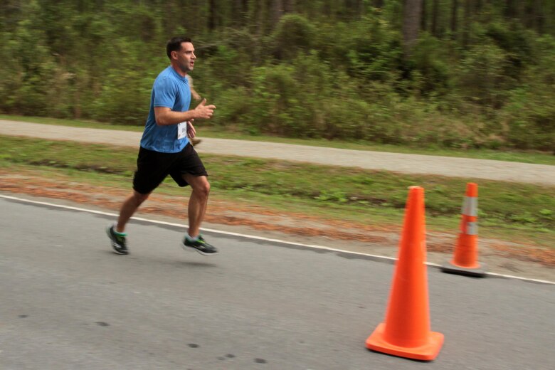 A participant in the Marine Corps Air Station Cherry Point and 2nd Marine Aircraft Wing Sexual Assault Awareness Month Commemorative 5K nears the finish line along Rifle Range Road, April 17, 2015. 
The event drew nearly 1,000 Marines, Sailors and Department of Defense employees who ran the 3.1 mile course to show solidarity with sexual assault survivors and a shared commitment to eradicating sexual violence across the Marine Corps.  