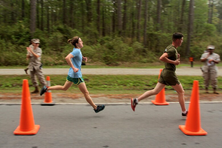First Lt. Kim Beaman nears the finish line during the Marine Corps Air Station Cherry Point and 2nd Marine Aircraft Wing Sexual Assault Awareness Month Commemorative 5K along Rifle Range Road, April 17, 2015. 
The event drew nearly 1,000 Marines, Sailors and Department of Defense employees who ran the 3.1 mile course to show solidarity with sexual assault survivors and a shared commitment to eradicating sexual violence across the Marine Corps.  
Beaman is the assistant staff secretary for 2nd MAW and finished the 5K with a time of 19 minutes, 4 seconds. 