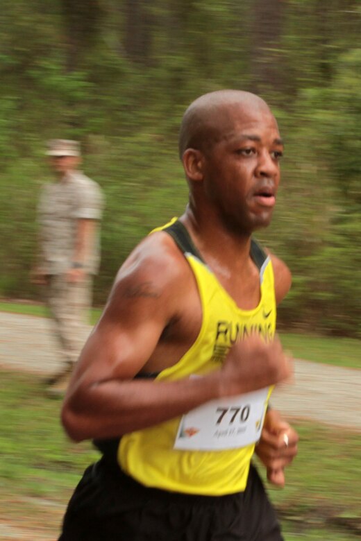 Master Sgt. Vincent C.Savage nears the finish line during the Marine Corps Air Station Cherry Point and 2nd Marine Aircraft Wing Sexual Assault Awareness Month Commemorative 5K along Rifle Range Road, April 17, 2015. 
The event drew nearly 1,000 Marines, Sailors and Department of Defense employees who ran the 3.1 mile course to show solidarity with sexual assault survivors and a shared commitment to eradicating sexual violence across the Marine Corps.  
Savage is the logistics chief for Headquarters and Headquarters Squadron. 