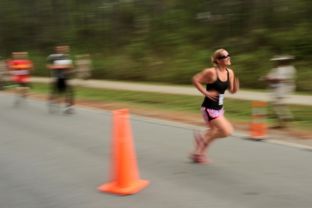A participant in the Marine Corps Air Station Cherry Point and 2nd Marine Aircraft Wing Sexual Assault Awareness Month Commemorative 5K nears the finish line along Rifle Range Road, April 17, 2015. 
The event drew nearly 1,000 Marines, Sailors and Department of Defense employees who ran the 3.1 mile course to show solidarity with sexual assault survivors and a shared commitment to eradicating sexual violence across the Marine Corps.  