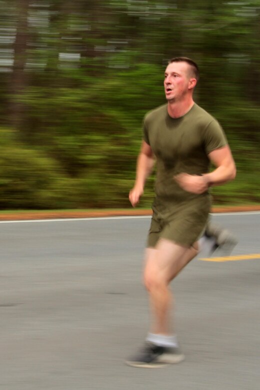 A participant in the Marine Corps Air Station Cherry Point and 2nd Marine Aircraft Wing Sexual Assault Awareness Month Commemorative 5K nears the finish line along Rifle Range Road, April 17, 2015. 
The event drew nearly 1,000 Marines, Sailors and Department of Defense employees who ran the 3.1 mile course to show solidarity with sexual assault survivors and a shared commitment to eradicating sexual violence across the Marine Corps.  