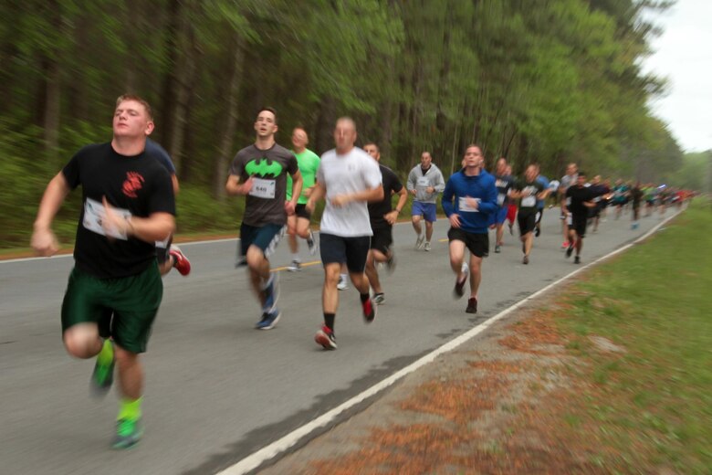 Participants in the Marine Corps Air Station Cherry Point and 2nd Marine Aircraft Wing Sexual Assault Awareness Month Commemorative 5K near the finish line along Rifle Range Road, April 17, 2015. 
The event drew nearly 1,000 Marines, Sailors and Department of Defense employees who ran the 3.1 mile course to show solidarity with sexual assault survivors and a shared commitment to eradicating sexual violence across the Marine Corps.  