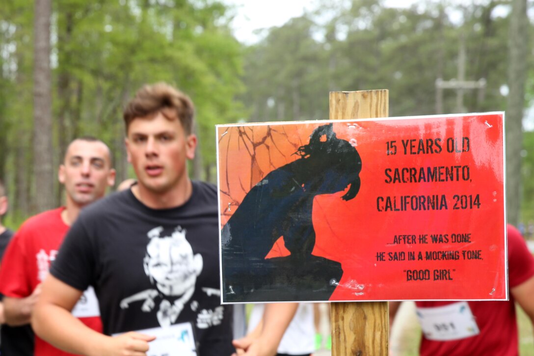 Participants run during the Marine Corps Air Station Cherry Point and 2nd Marine Aircraft Wing Sexual Assault Awareness Month Commemorative 5K, April 17, 2015. 
The event drew nearly 1,000 Marines, Sailors and Department of Defense employees who ran the 3.1 mile course to show solidarity with sexual assault survivors and a shared commitment to eradicating sexual violence across the Marine Corps.  