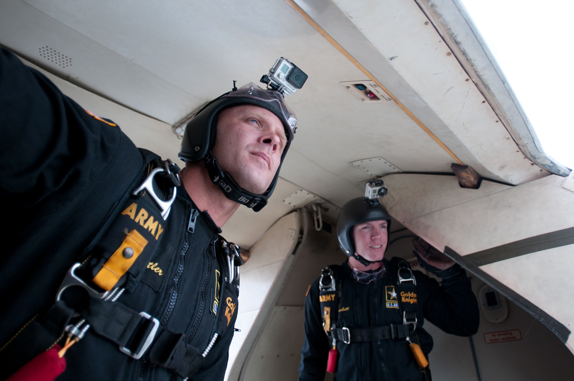 Sgt. 1st Class Teigh Statler (left) and Staff Sgt. James Hackett, members of the U.S. Army Parachute Team, also known as The Golden Knights, assesses wind conditions as the team prepares to perform a practice jump into downtown Louisville, Ky., on April 17, 2015. The Golden Knights are performing in the 2015 Thunder Over Louisville air show April 18. (U.S. Air National Guard photo by Master Sgt. Phil Speck)