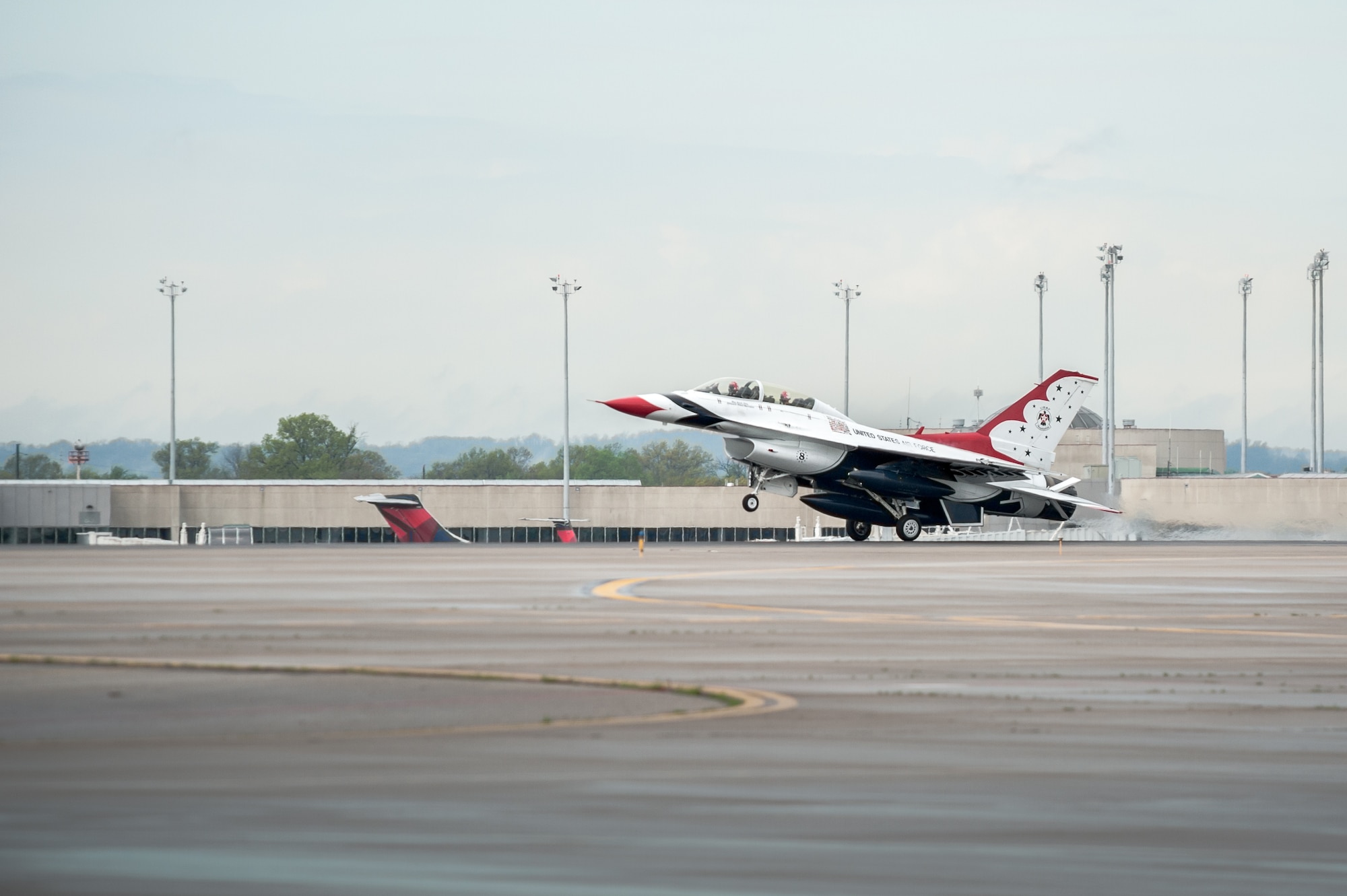 A U.S. Air Force Thunderbirds F-16  aircraft arrives at the Kentucky Air National Guard Base in Louisville, Ky., April 16, 2015. The Thunderbirds are performing in the 2015 Thunder Over Louisville air show, to be held April 18 over the Ohio River in downtown Louisville. The Kentucky Air Guard is providing logistical support to military aircraft flying in the air show. (U.S. Air National Guard photo by Maj. Dale Greer)