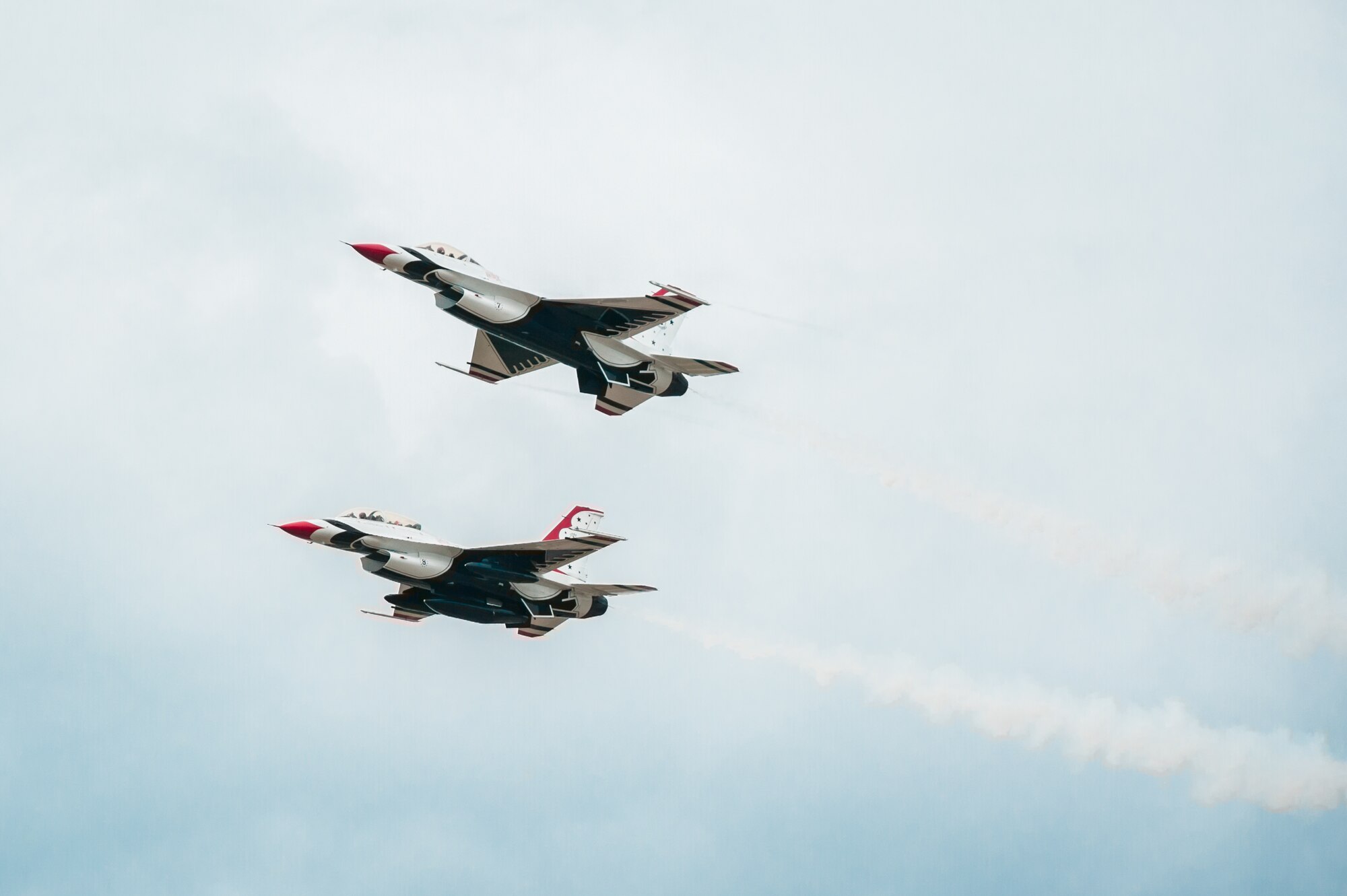 Members of the U.S. Air Force Thunderbirds aerial demonstration squadron fly over the Kentucky Air National Guard Base in Louisville, Ky., April 16, 2015, prior to landing. The Thunderbirds are performing in the 2015 Thunder Over Louisville air show, to be held April 18 over the Ohio River in downtown Louisville. The Kentucky Air Guard is providing logistical support to military aircraft flying in the air show. (U.S. Air National Guard photo by Maj. Dale Greer)