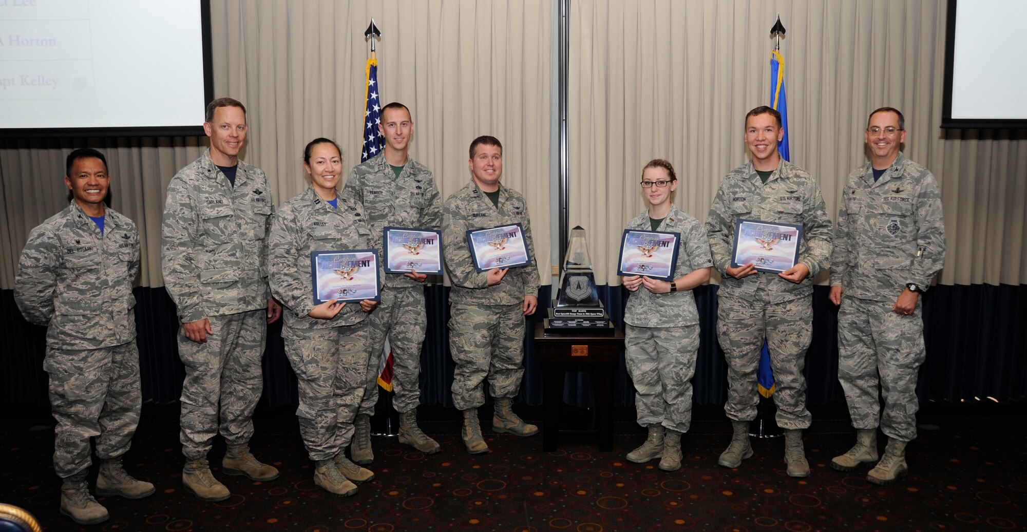 The winning crew of the 2015 Top Hawk competition, led by Col. Keith Balts, 30th Space Wing commander, is recognized by General Steven Garland, 14th Air Force vice commander, and Col. Marc Del Rosario, 30th Operations Group commander, April 17, 2015, Vandenberg Air Force Base, Calif. The competition, initially created in lieu of the Air Force Space Command’s Guardian Challenge, is designed to present numerous launch scenarios for crew members and puts 30th Operations Group launch teams against each other to determine the best of the best. (U.S. Air Force Photo by Airman Robert J. Volio/Released)