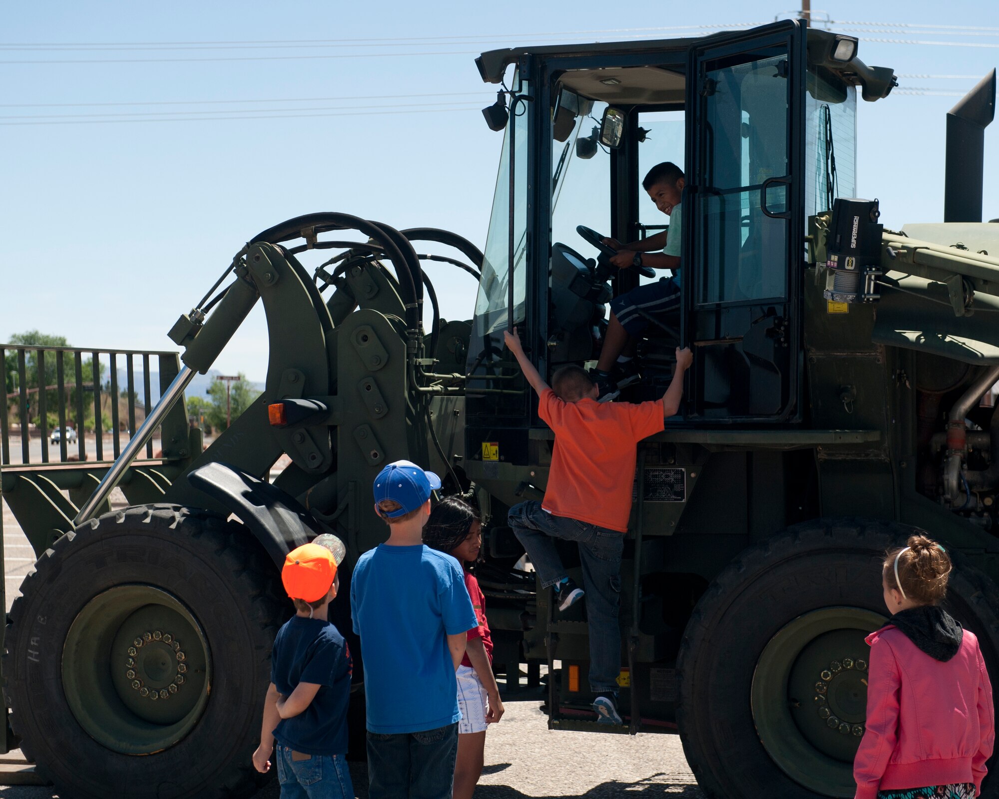 The Logistics Readiness Squadron provided several vehicles for “bring your child to work day” to be enjoyed by military members and their dependents as a part of Month of the Military Child at Holloman Air Force Base N.M., April 17, 2015. The Month of the Military Child is to honor the sacrifices and hardships that military children are born into, going through long periods without one or both of their parents due to deployments, temporary duty or swing shifts. (U.S. Air Force photo by Senior Airman Chase Cannon/ Released)