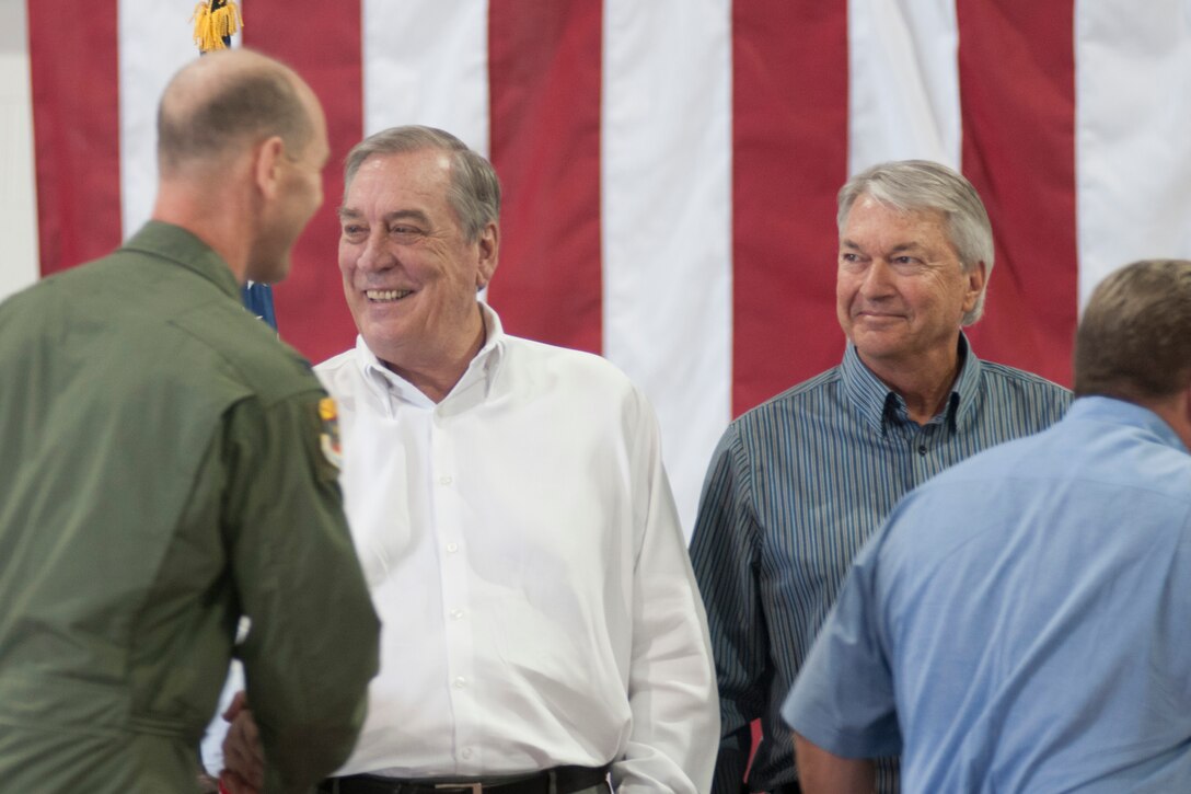 Honorary wing commander Robert McMahon, left, and honorary Operations Group commander Don Pooley, right, are welcomed by Col. Troy Daniels, 214th Reconnaissance Group commander, during the 162nd Wing’s annual awards ceremony April 12. The Honorary Commander Program is a civic outreach initiative to help community leaders learn more about the Air National Guard and its mission, and to help military leaders of the 162nd learn more about the community in which they live. (U.S. Air National Guard photo/Tech. Sgt. Hollie Hansen)