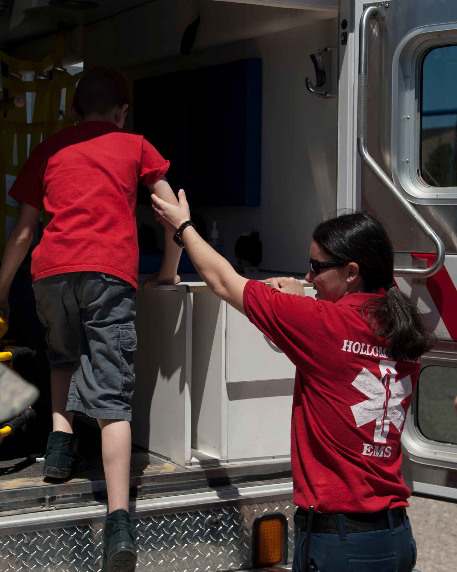 Emergency Medical Services allowed military dependents to get an up close look at the inside of an ambulance during “bring your child to work day” at Holloman Air Force Base N.M., April 17, 2015. Bring your child to work day gives military members a chance to show their children what their day to day jobs consist of, as well as show off some of the more fun parts of being in the military. (U.S. Air Force photo by Senior Airman Chase Cannon/ Released)