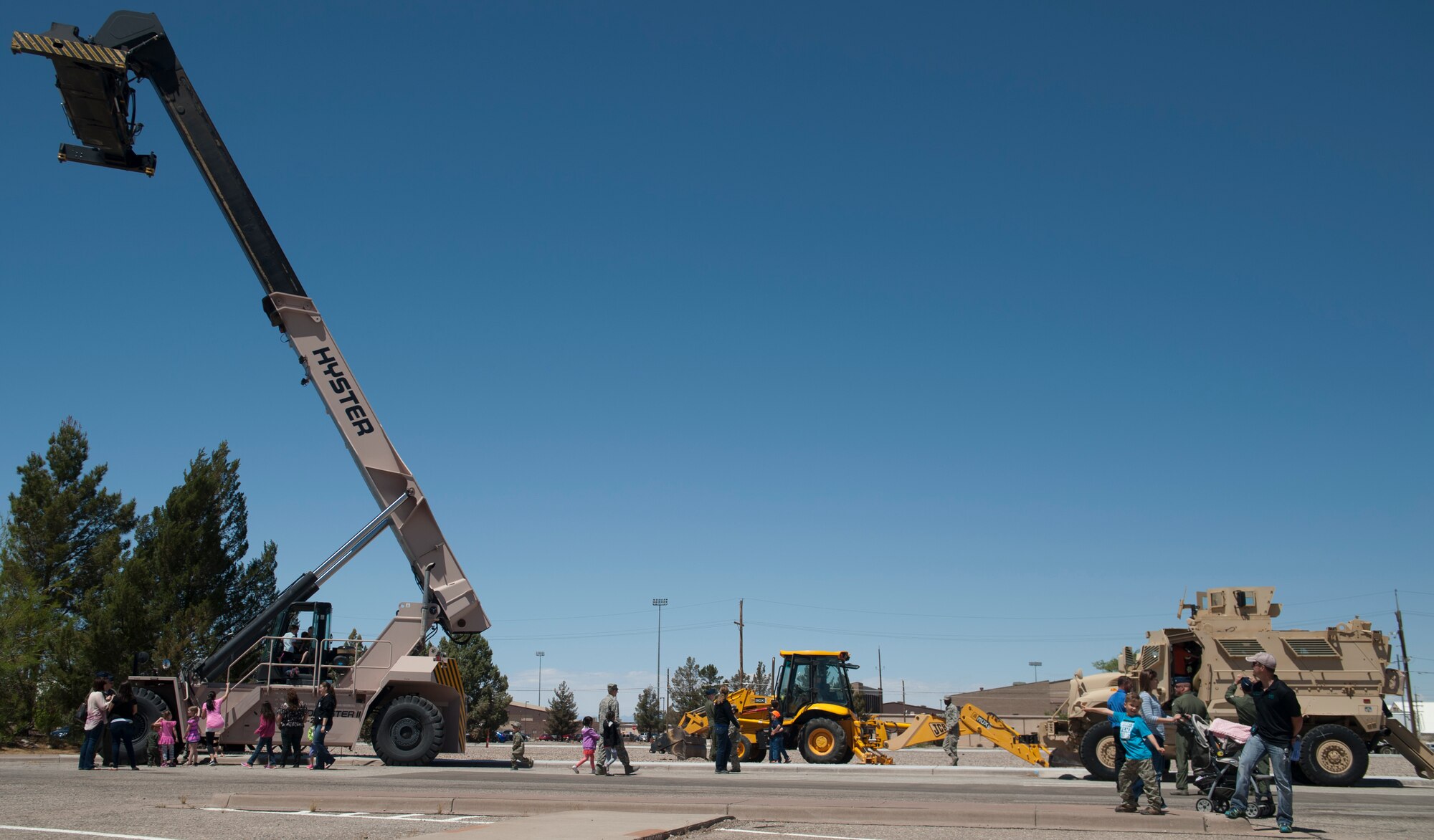 Several large vehicles used during daily military operations were put on display during “bring your child to work day” at Holloman Air Force Base N.M., April 17, 2015. “Bring your child to work day” is set aside so that members of Team Holloman can bring their children into work, and show them the day to day operations of a military base. (U.S. Air Force photo by Senior Airman Chase Cannon/ Released)