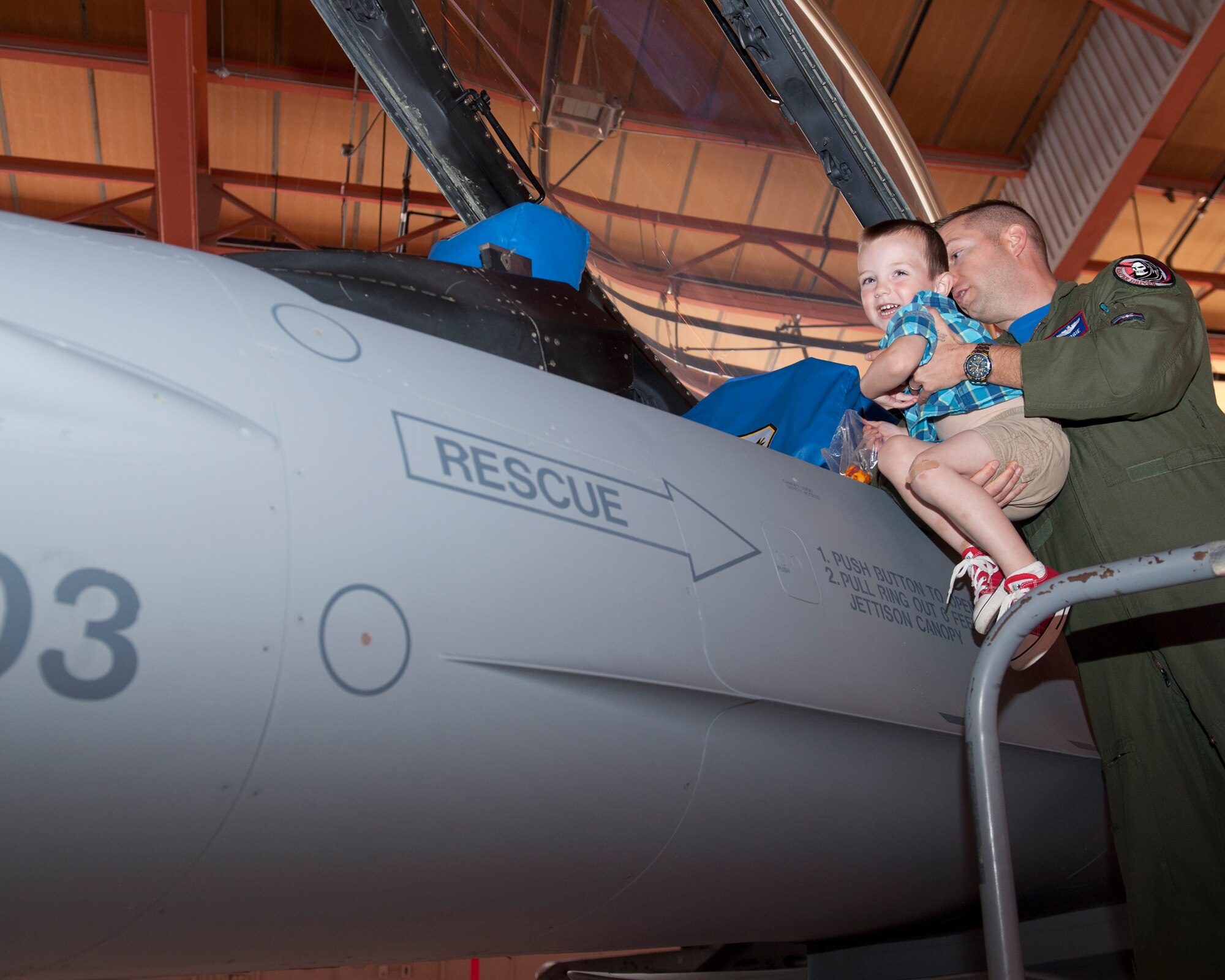 A military member and his son enjoy “bring your child to work day” at Holloman Air Force Base N.M., April 17, 2015. “Bring your child to work day” is set aside so that members of Team Holloman can bring their children into work, and show them the day to day operations of a military base. (U.S. Air Force photo by Senior Airman Chase Cannon/ Released)