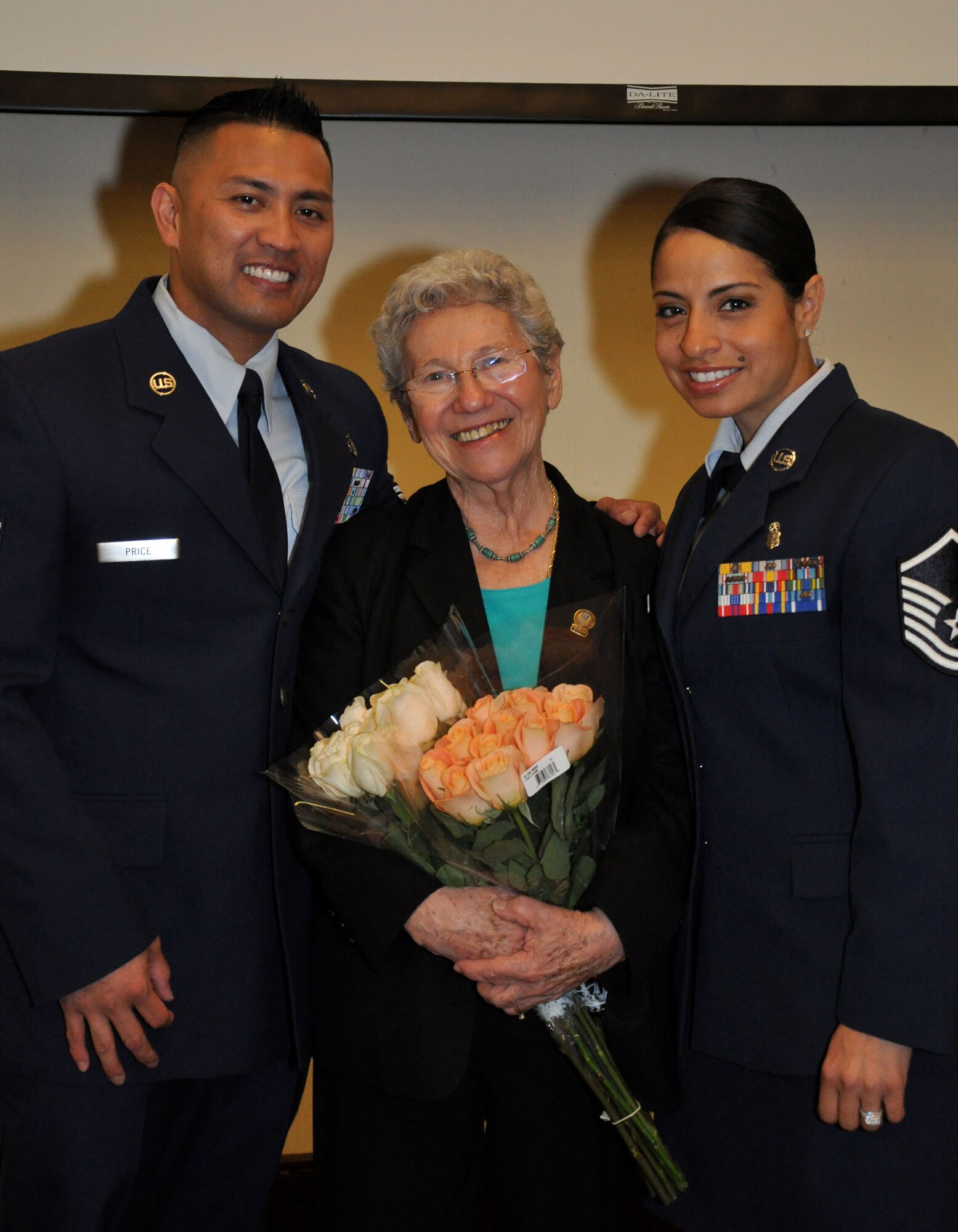 Master Sgt. Vanessa Hernandez and Tech. Sgt. Jeff Price, co-chairs of the Holocaust Days of Remembrance breakfast committee pose for a picture with Holocaust survivor Liz Igra at Beale Air Force Base, Calif., April 17, 2015. Igra has made it her life’s work to educate younger generations about the importance of remembering and understanding the Holocaust. (U.S. Air Force photo by Airman 1st Class Taylor A. Workman/Released)