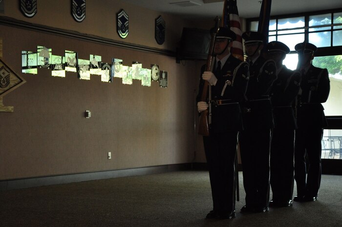 The Beale Honor Guard waits to post the colors before commencing the Days of Remembrance breakfast held at Beale Air Force Base, Calif., April 17, 2015. The Days of Remembrance were created for civic commemorations and special educational programs that help citizens remember and draw lessons from the Holocaust.  (U.S. Air Force photo by Airman 1st Class Taylor A. Workman/Released)