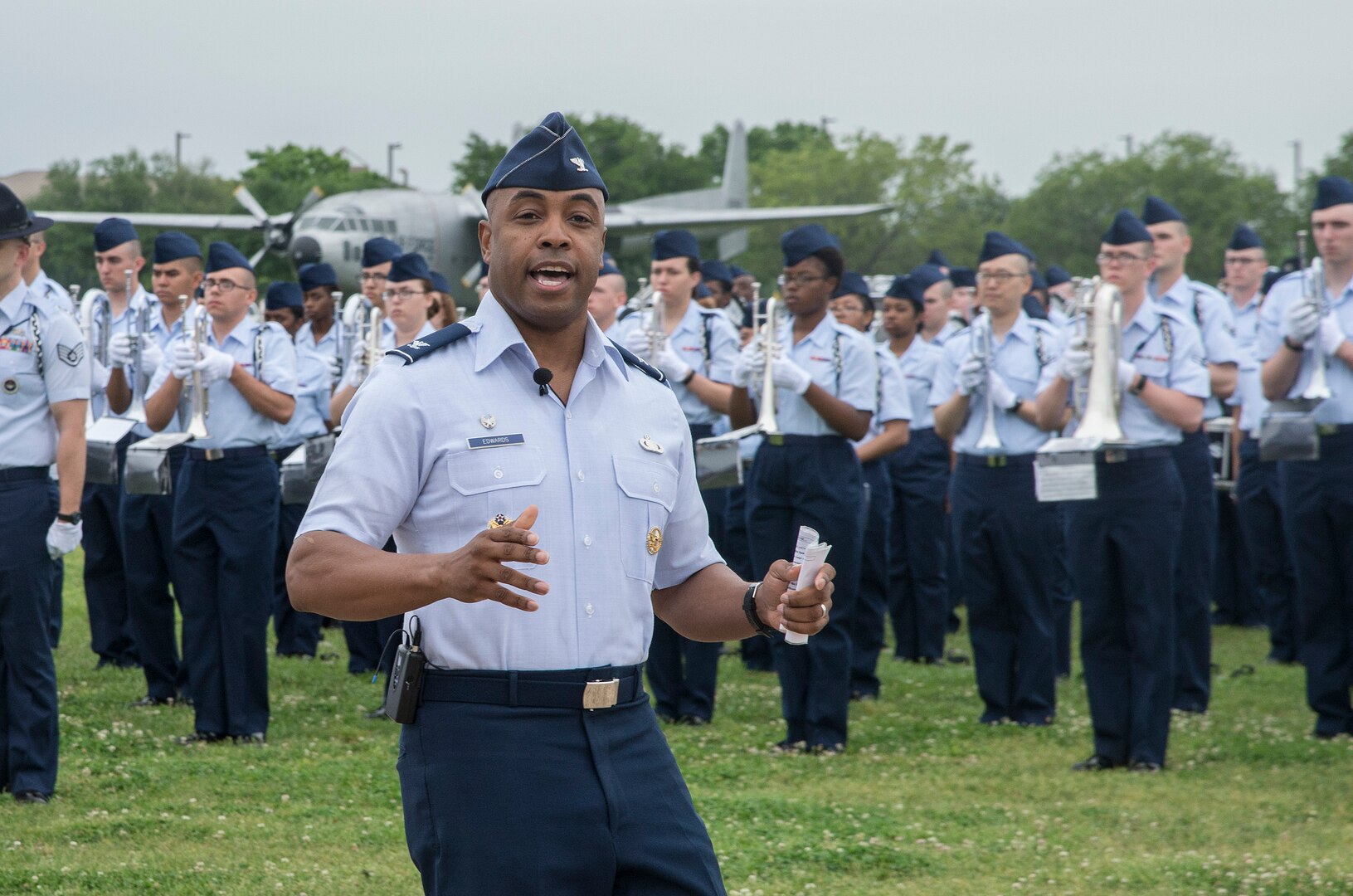 Col. Trent Edwards, 37th Training Wing commander, addresses the Basic Military Training graduation trainees, families and visitors April 17, 2015, at Joint Base San Antonio-Lackland, Texas. The full-scale Basic Military Training Graduation Parade is the only military graduation incorporated into Fiesta and features more than 1,000 distinctive military members and the 323rd Training Squadron Drum and Bugle Corps. Fiesta San Antonio, the city's 11-day cascarón-filled celebration, began as a one-time parade in 1891 to honor the memory of the heroes of the Alamo and the Battle of San Jacinto. Over the past century, Fiesta has grown into a celebration of San Antonio's rich and diverse cultures. Military representative from throughout San Antonio participate in receptions, parades, pilgrimages and memorials. (U.S. Air Force photo by Johnny Saldivar/released)