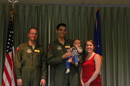 Lt. Col. Patrick Farrell, 16th Airlift Squadron commander (left) presented a Medal of Application to Ethan George, one of the squadron’s Little Lions during the Little Lions ceremony April 10 2015 in the squadron’s auditorium at Joint Base Charleston, S.C. Ethan’s parents are Capt. Brian George, 16th AS and Brooke George.   In all, 35 Little Lions were recognized, and no achievement was too small; everything from helping around the house to making the high school honor list was celebrated.  Each child was given a medal and certificate to thank them for their bravery. (Courtesy photo)

