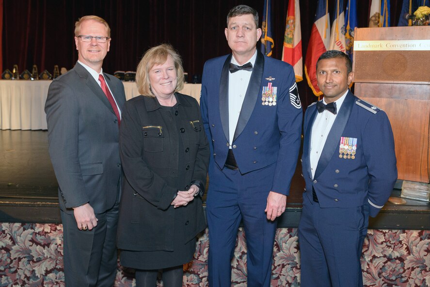 Tom Ritzert (left), director of Quality for the Boeing Company, represents the corporation as the 2014 446th Airlift Wign Employer of the Year at the wing's 2015 annual awards banquet April 11 at the Landmark Convention Center, Tacoma. Ritzert is pictured with (left to right) his wife, Susan, Senior Master Sgt. Kelly Henderson, 446th AW Inspector General Inspections, and Lt. Col. Nikhil Patel, 446th Mission Support Group deputy commander. Patel and Henderson, full-time Boeing employees, submitted the company's nomination. (Courtesy photo by David Lobban Photography)