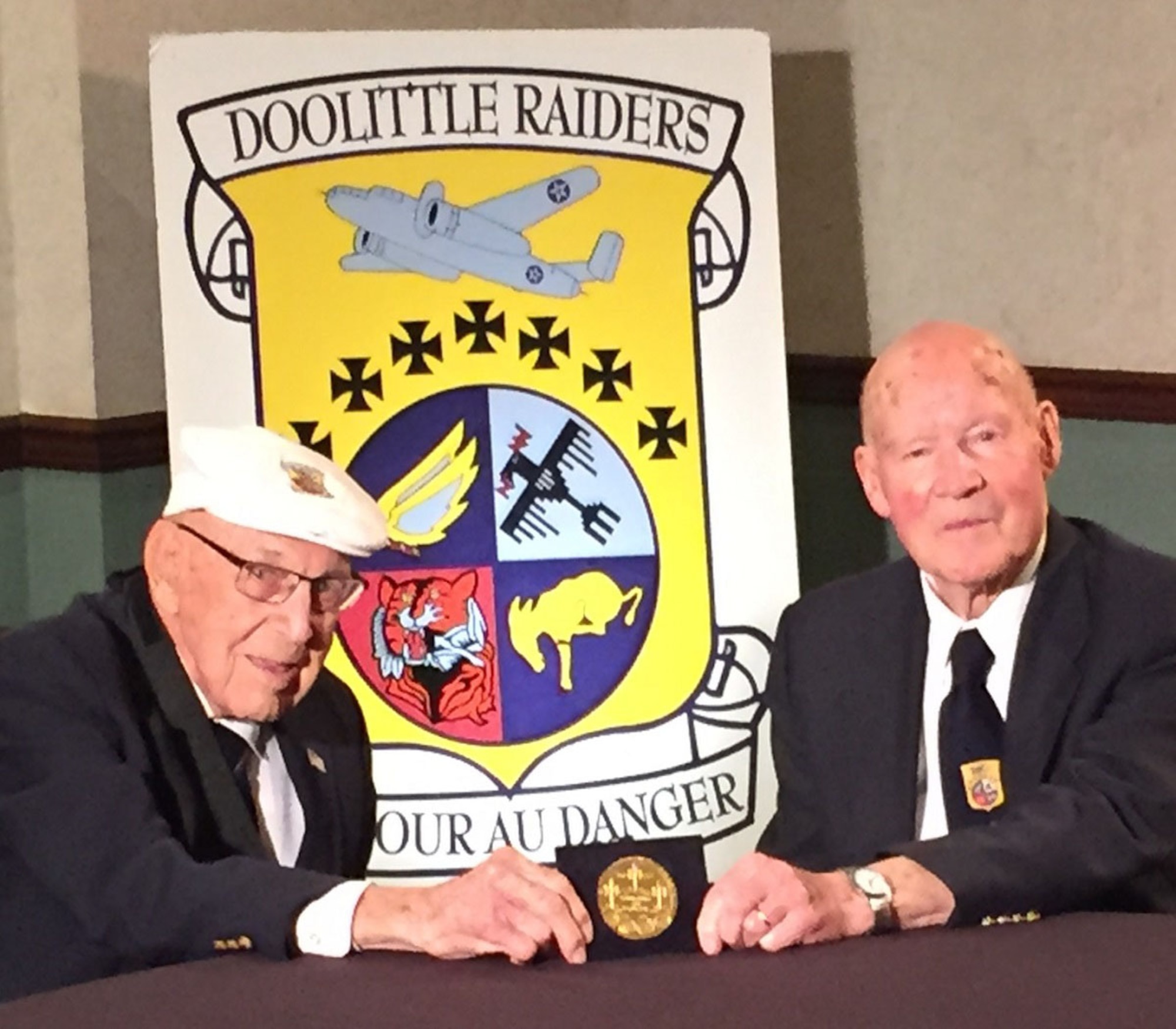 DAYTON, Ohio -- Doolittle Tokyo Raiders Lt. Col. Richard Cole, co-pilot of Crew No. 1, and Staff Sgt. David Thatcher, engineer-gunner of Crew No. 7, see their Congressional Gold Medal for the first time on April 17, 2015. During a ceremony on April 18 at the museum, the medal will be presented to the museum for inclusion in the Doolittle Raid exhibit. (U.S. Air Force photo)