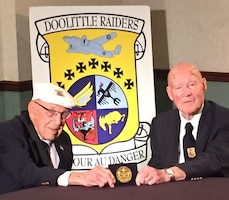 DAYTON, Ohio -- Doolittle Tokyo Raiders Lt. Col. Richard Cole, co-pilot of Crew No. 1, and Staff Sgt. David Thatcher, engineer-gunner of Crew No. 7, see their Congressional Gold Medal for the first time on April 17, 2015. During a ceremony on April 18 at the museum, the medal will be presented to the museum for inclusion in the Doolittle Raid exhibit. (U.S. Air Force photo)