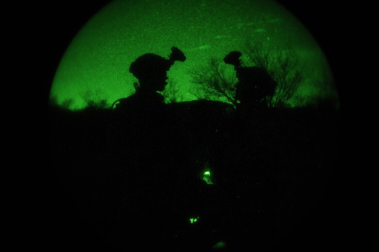 U.S. Air Force Pararescuemen assigned to the 48th Rescue Squadron wait for a HH-60G Pavehawk to arrive during a mass casualty exercise at Davis-Monthan Air Force Base, Ariz., April 14, 2015. During the exercise, the Airmen were evaluated on how they respond to several mass casualty situations to include their ability calling in air support for patient extrication. (U.S. Air Force photo by Senior Airman Betty R. Chevalier) 