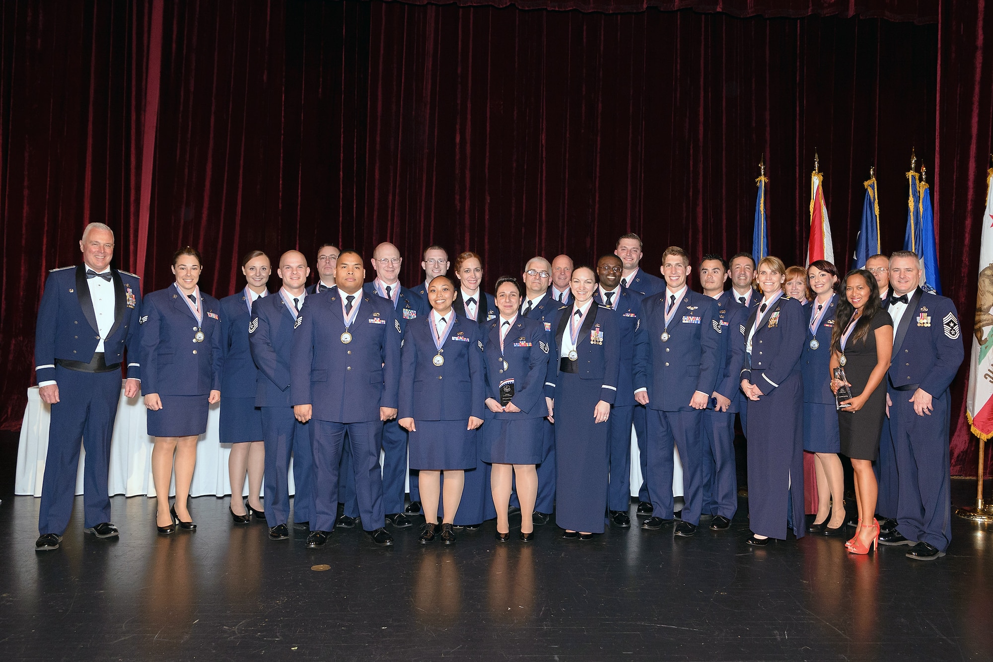 Annual Award recipients pose for a group shot at the 2015 446th Airlift Wing Annual Awards Banquet April 11 at the Landmark Convention Center, Tacoma. About 500 wing Reservists, civilians, and family members attended the event to honor the awardees recognized throughout the wing, and command-level. (Courtesy photo by David Lobban Photography, Inc.)