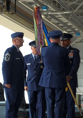 Lt. Gen. Steven Wilson, Air Force Global Strike Command commander, presents the Eighth Air Force guidon to Maj. Gen. Richard Clark, 8th AF commander, during the Eighth Air Force Change of Command ceremony on Barksdale Air Force Base, La., April 17, 2015. Clark has served the Air Force since 1986 and was previously vice commander for Air Force Global Strike Command. (U.S. Air Force photo/Senior Airman Kristin High)