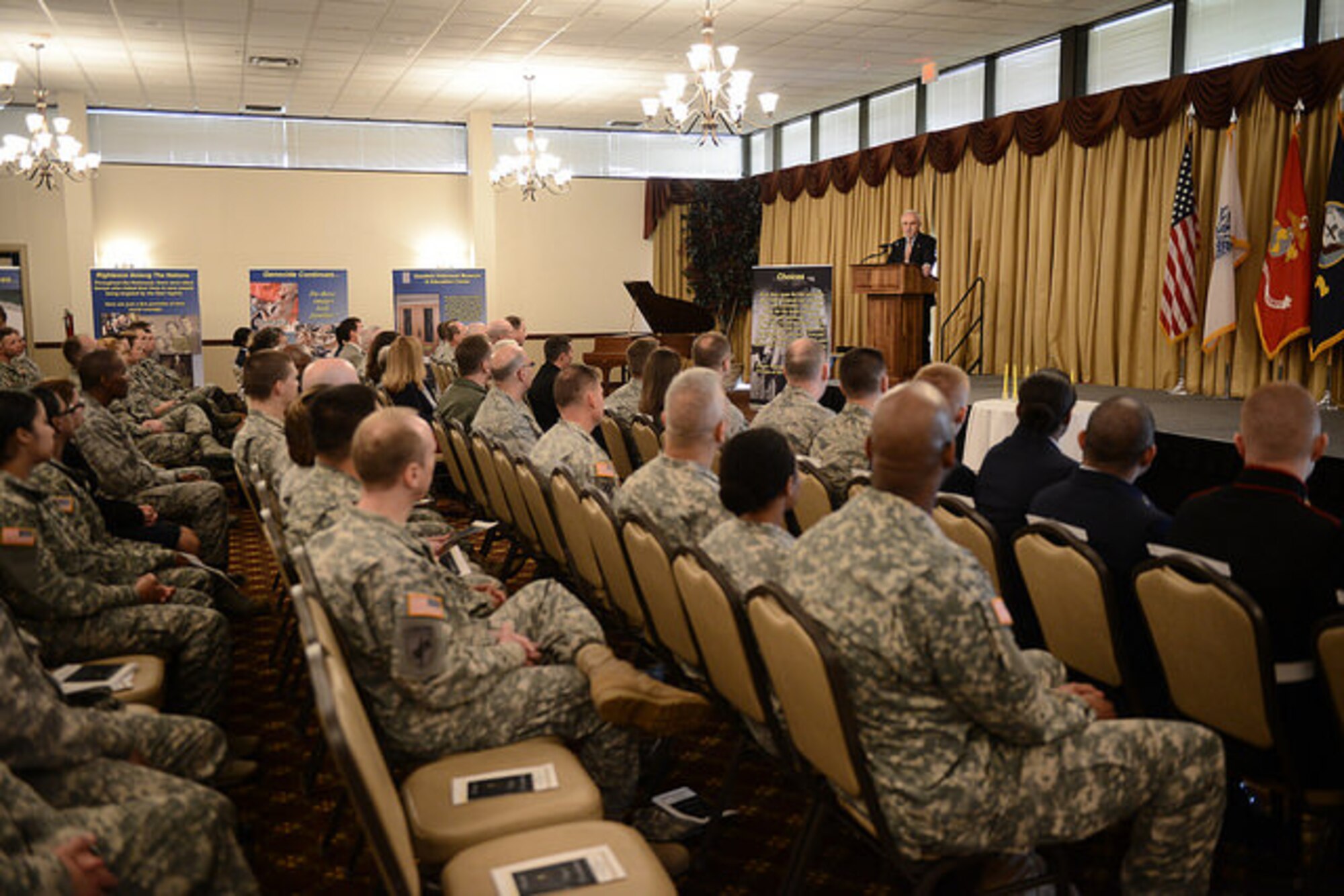 Dr. Charles Rojer, Holocaust survivor and Days of Remembrance guest speaker, shares his story with the joint base community during the annual event on Joint Base McGuire-Dix-Lakehurst, N.J. April 16, 2015. This year marks the 70th anniversary since concentration camps were liberated by allied forces. (U.S. Air Force photo by Airman 1st Class Joshua King)