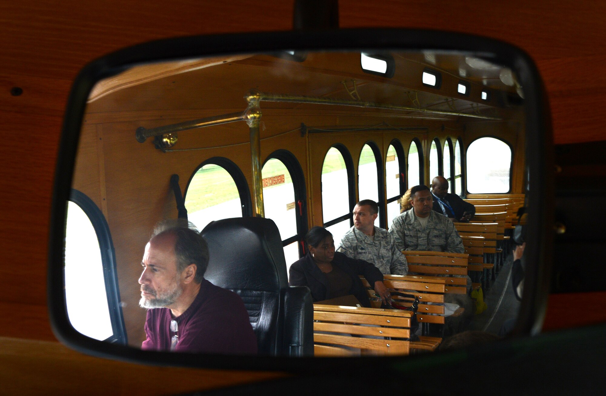 Participants of the first ever newcomers tour ride on a trolley at Shaw Air Force Base, S.C., April 16, 2015. During the monthly tour, participants visit the weapons standardization building, the mission support center, and see the base through a trolley window. (U.S. Air Force photo by Senior Airman Jensen Stidham/Released)