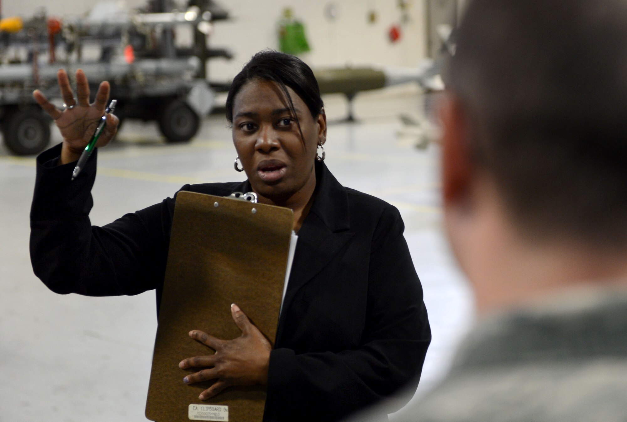 A participant of the newcomers tour asks a question about the F-16CM Fighting Falcon at Shaw Air Force Base, S.C., April 16, 2015.  During the tour, participants received an up-close look at the aircraft and learned about its capabilities. (U.S. Air Force photo by Senior Airman Jensen Stidham/Released) 