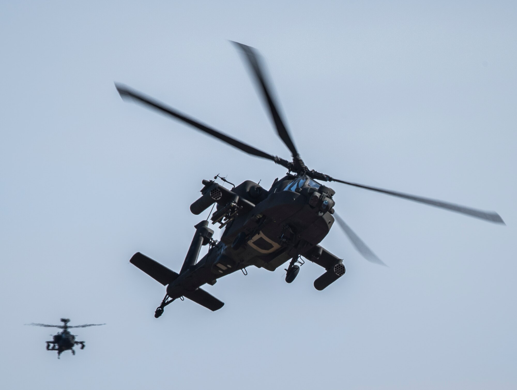 U.S. Army AH-64 Apaches from Gowen Air Field, Idaho, provide cover to ground forces during Gunfighter Flag 15-2 at Saylor Creek Range, Idaho, April 15, 2015. The exercise focused on integrating air and ground forces in a realistic training environment similar to Southwest Asia. (U.S. Air Force photo by Airman 1st Class Jeremy L. Mosier/Released)