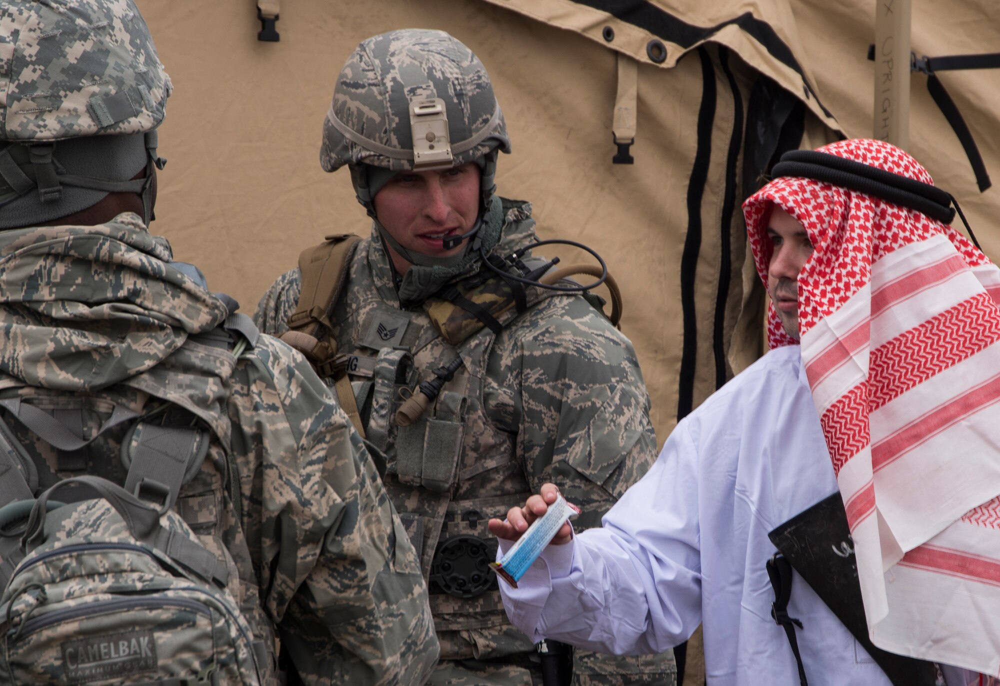 Airmen from Mountain Home Air Force Base dress up and act out scenarios during Gunfighter Flag 15-2 at Saylor Creek Range, Idaho, April 14, 2015. Gunfighter Flag 15-2 execute realistictactical scenarios to train joint service members for down range missions. (U.S. Air Force photo by Staff Sgt. Roy Lynch III/Released