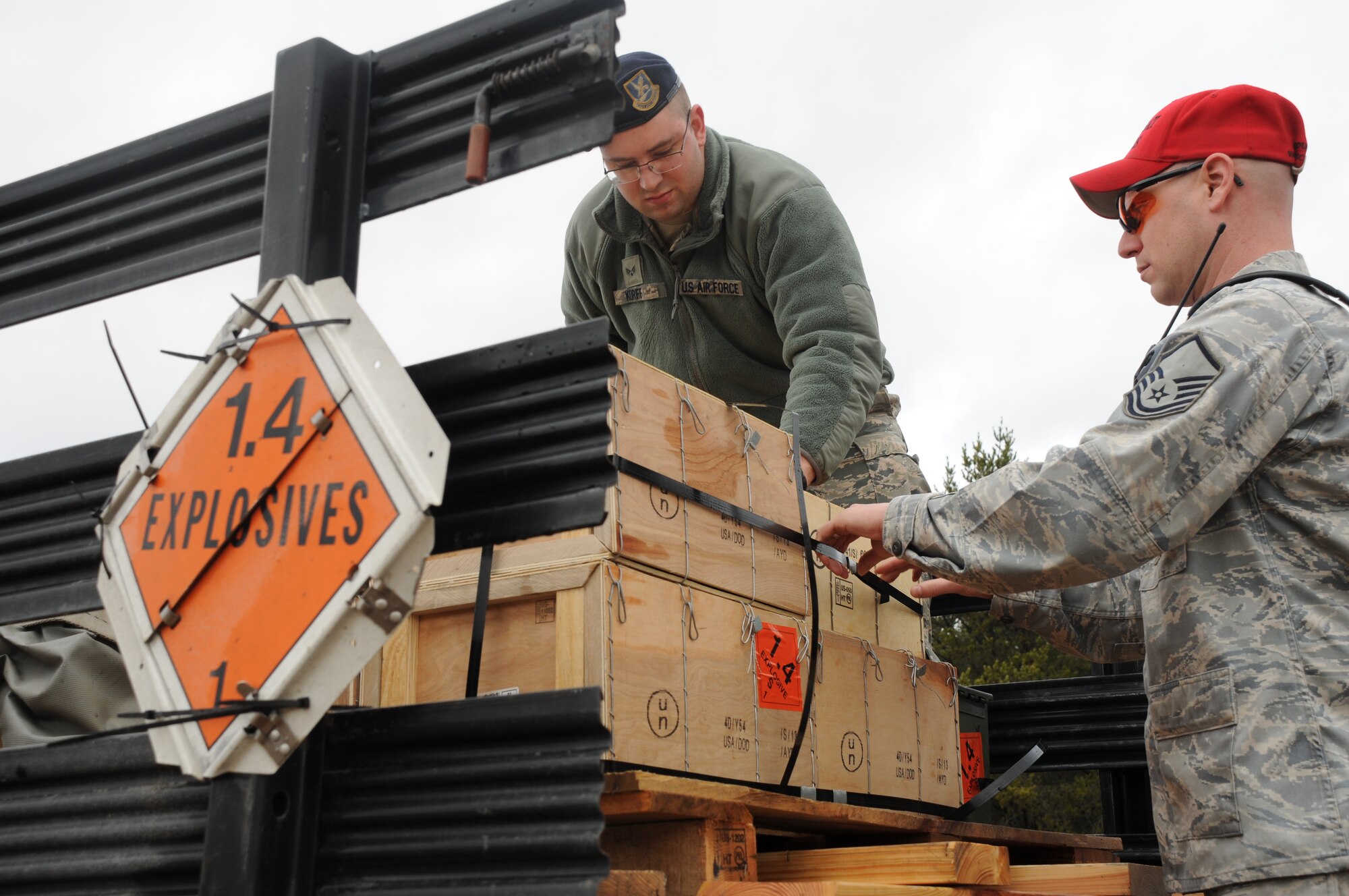 Senior Airman Bryan Korff and Master Sgt. Stephen Houseman unload ammunition crates at Canadian Forces Base Borden, ON, Canada on April 10, 2015. Korff and Houseman were instructing members of the 914th Security Forces Squadron proper weapon employment. (U.S. Air Force photo by Staff Sgt. Matthew Burke)