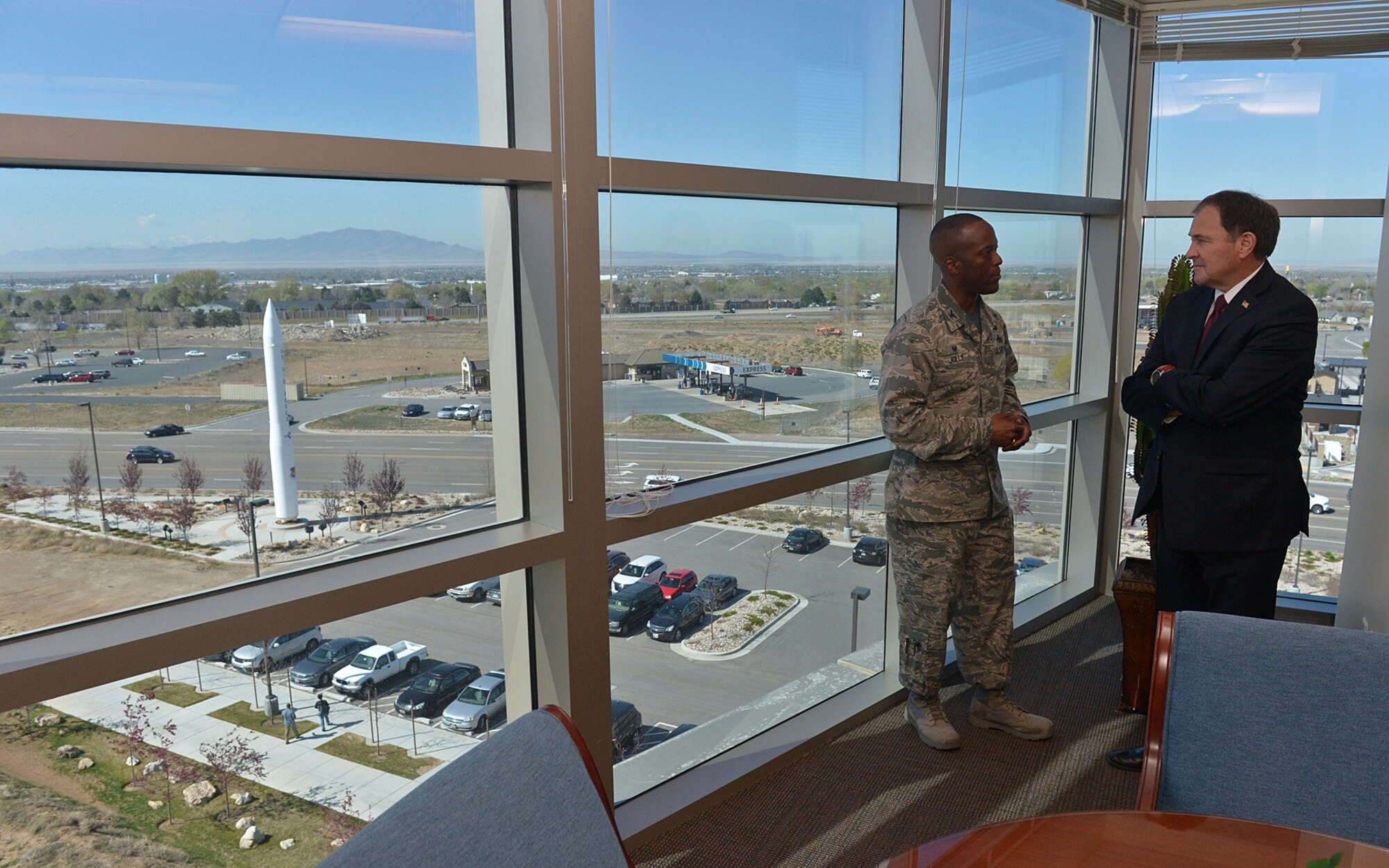 Col. Ron Jolly, 75th Air Base Wing commander, talks with Utah Gov. Gary Herbert on April 10 at Hill Air Force Base. Herbert visited the installation along with Maj. Gen. Jeff Burton, Utah National Guard adjutant general, to receive an update on Hill’s missions. (U.S. Air Force/Alex R. Lloyd)
