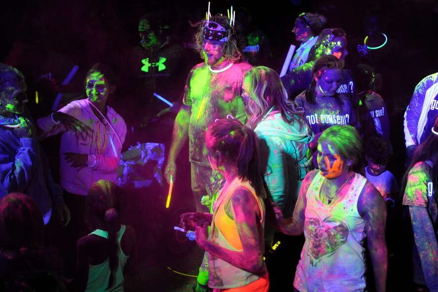 Airmen and families from across Team Hill gather for a Glow Run April 10, 2015, at Hill Air Force Base. For more information about sexual assault prevention programs at Hill, call 801-777-1985 or 801-777-1964. (DAVID PERRY/U.S. Air Force)