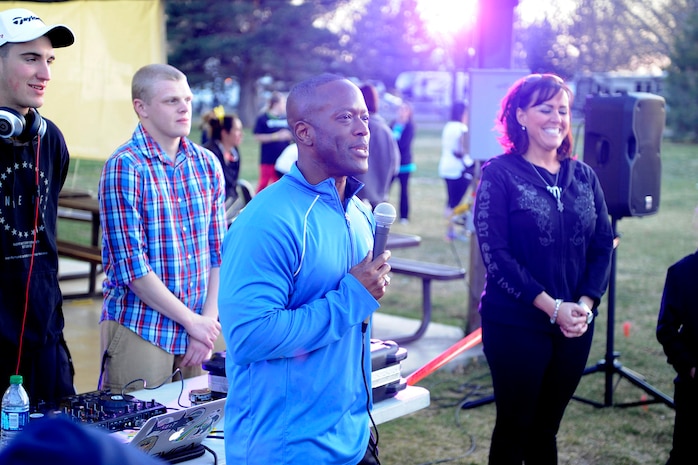 Col. Ron Jolly, 75th Air Base Wing commander speaks to Airmen and families from across Team Hill who gathered for a Glow Run April 10 at Hill Air Force Base. The event was held to bring awareness to sexual assault and child abuse prevention. For more information on sexual assault prevention programs at Hill, call 801-777-1985 or 801-777-1964. (Air Force photo/David Perry)