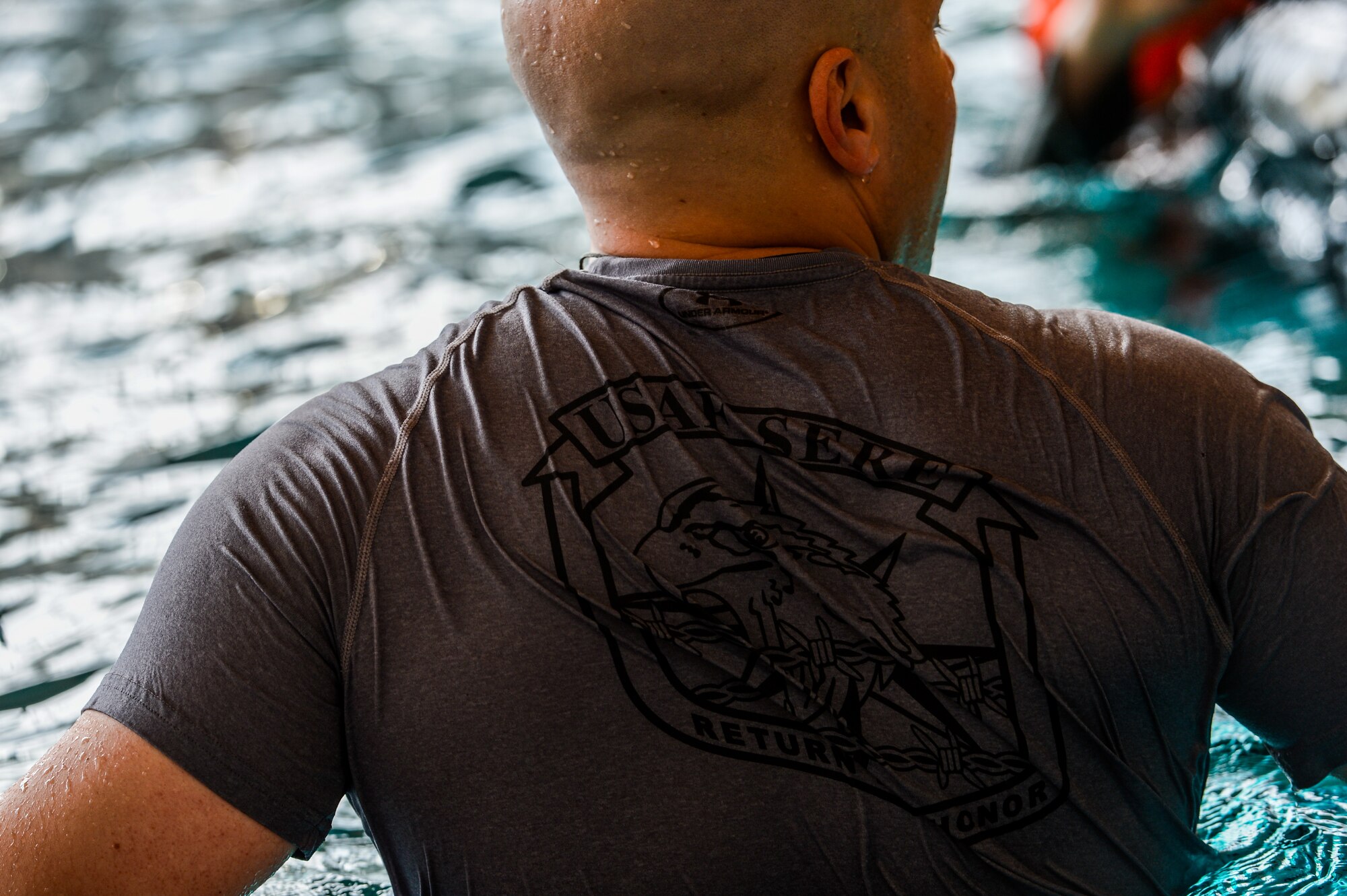 Tech. Sgt. Reid Allen, 86th Operations Support Squadron survival, evasion, resistance and escape specialist, evaluates trainees during a water survival training course April 13, 2015, at Ramstein Air Base, Germany.  The course is designed to train service members on survival techniques they may need during a water emergency.  (U.S. Air Force photo/Senior Airman Nicole Sikorski)