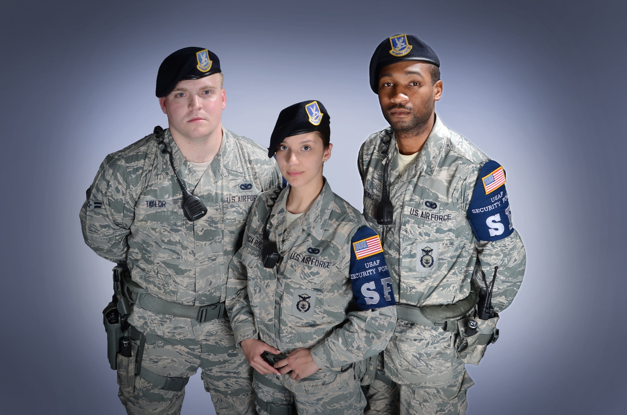 From left, Senior Airman Brenton Taylor, Airman 1st lass Maria Valencia-Ruiz and Senior Airman Derrick Thomas are three of the 22 security forces Airmen serving in the Elite Gate Guard section at Robins. Members must apply for their positions and are chosen based on overall professional customer service and courtesy. (U.S. Air Force photo by Tommie Horton)