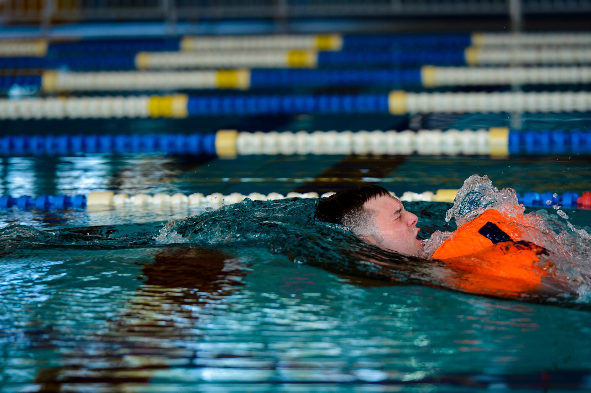 Senior Airman Robert Newman, 86th Aeromedical Evacuation Squadron mission management technician, performs a wind drag during a survival, evasion, resistance and escape water survival course April 13, 2015, at Ramstein Air Base, Germany. Drags are practiced to simulate a parachute opening after evacuating an aircraft. (U.S. Air Force photo/Senior Airman Nicole Sikorski)