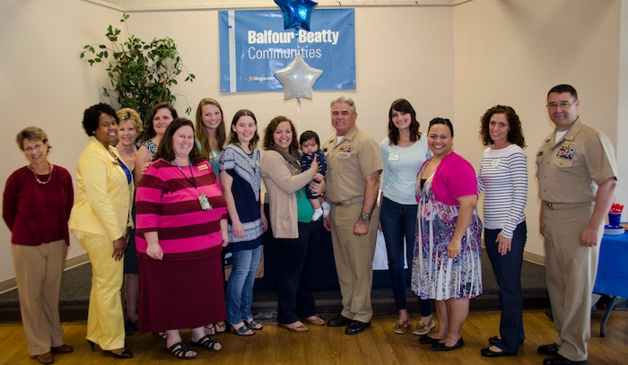 CAPT Timothy Sparks, Joint Base Charleston deputy commander, recognizes volunteers from the Navy-Marine Corps Relief Society during a volunteer recognition luncheon, April 16, 2015 at Joint Base Charleston – Weapons Station, S.C. National Volunteer Week (April 12-18, 2015) is a program established by the Points of Light. Points of Light was founded in 1990 by President George H.W. Bush as an independent, nonpartisan, nonprofit organization to encourage and empower the spirit of service. (U.S. Air Force photo/Staff Sgt. AJ Hyatt)

